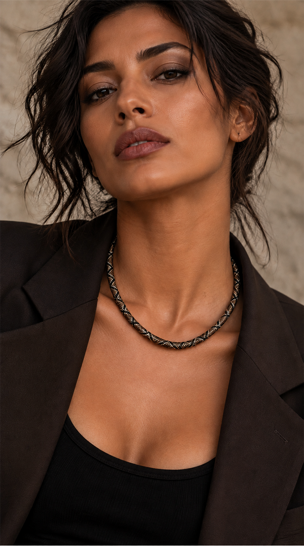 Man wearing a bronze serpent necklace